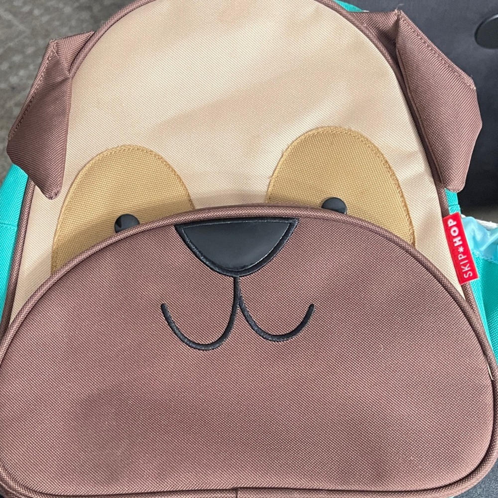 Skip Hop Brown and Tan Dog Backpack with Teal Accents. Gently loved.